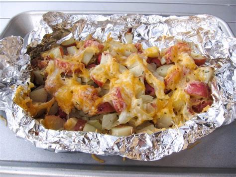 Cook These Cheesy Potato Tin Foil Packets Directly On The Coals