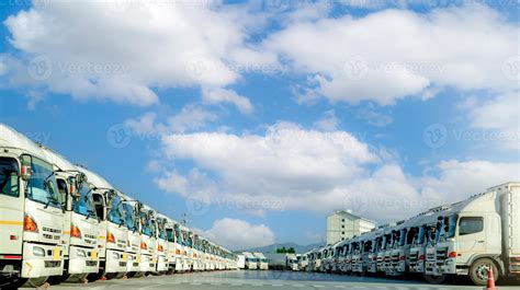 Fleet of trucks parked at parking lot yard of delivery company. Truck transport. Logistic ...