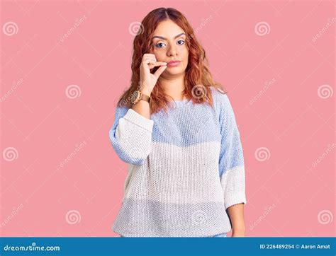 Young Latin Woman Wearing Casual Clothes Mouth And Lips Shut As Zip