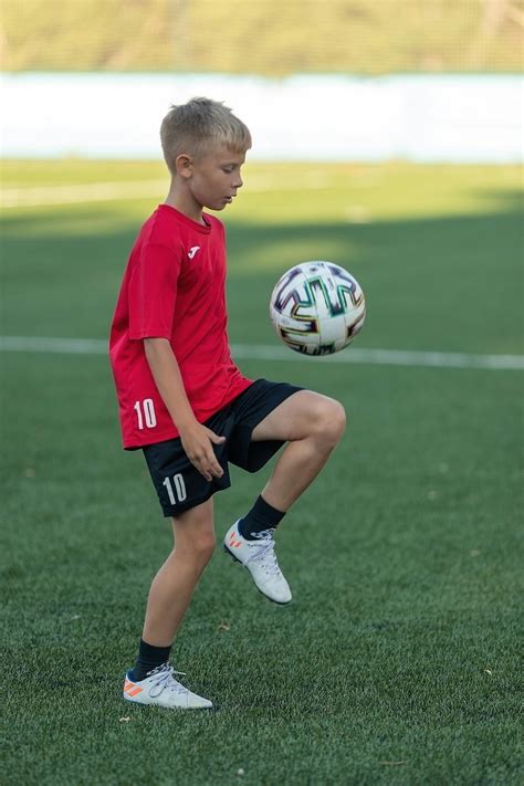 boy kicking  soccer ball  stock photo