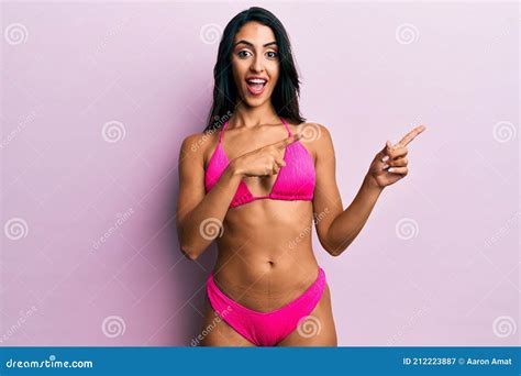 Beautiful Hispanic Woman Wearing Bikini Smiling And Looking At The