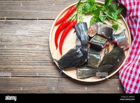 fresh raw catfish menu freshwater fish catfish fillet  wooden plate