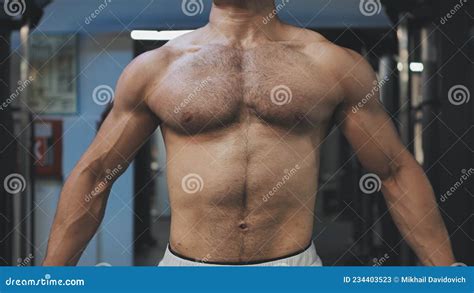 Muscular Man Workout In Gym Doing Exercises For Chest Cable Crossover