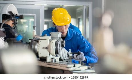 Caucasian Industrial Worker Metalworking Industry Lathe Stock Photo