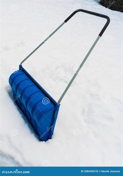 Large Snow Shovel Sitting In A Deep Pile Of Snow Stock Photo Image Of