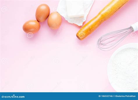 Frame Of Food Ingredients On A Pastel Pink Background Baking Concept