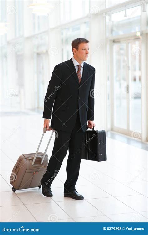 Young Business Man Holding A Suitcase And Bag Stock Photo Image Of