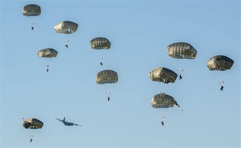 U.S. Army 173rd Airborne Brigade and German Army 1st Airborne Brigade paratroopers parachute ...