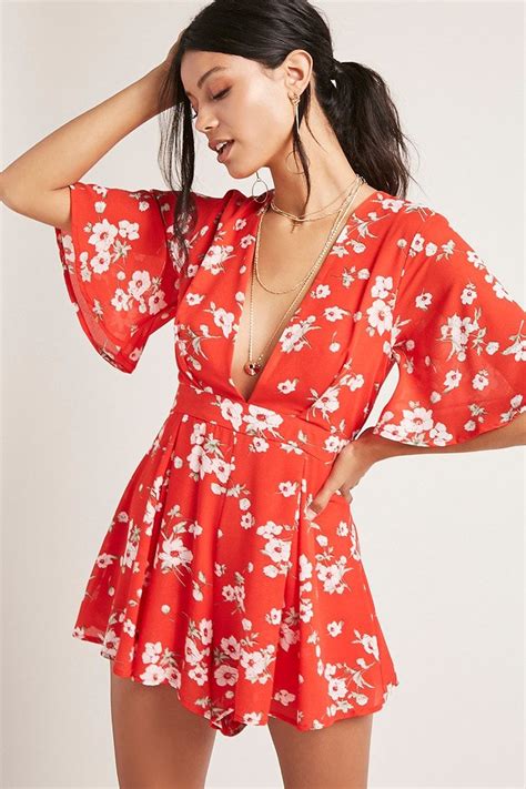 A Woven Romper Featuring An Allover Floral Print A Plunging V Neckline