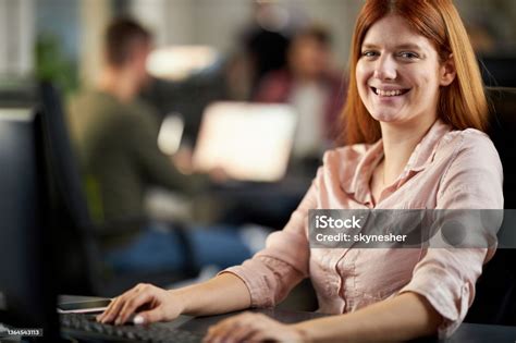 Happy Female Programmer Working On Pc In The Office Stock Photo