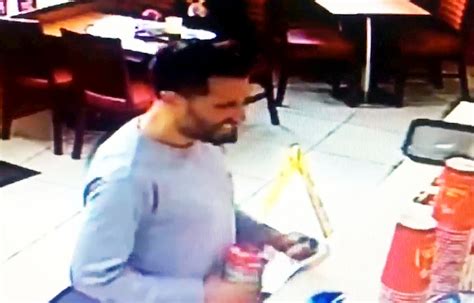 Brazen Thief Caught On Cctv Stealing Charity Box From Fast Food Restaurant While Joking With