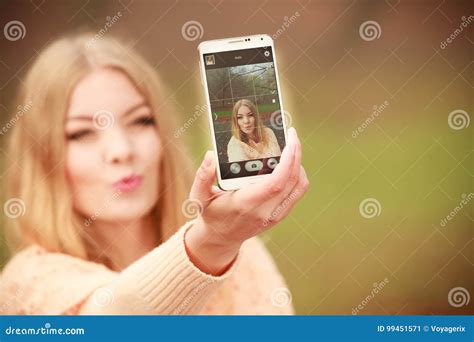 Girl Taking Self Picture With Smartphone Camera Outdoors Stock Image