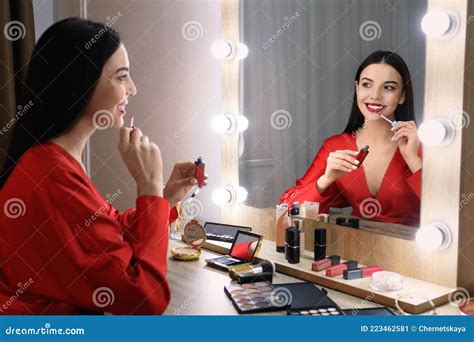 Beautiful Woman Applying Makeup Near Mirror Stock Image Image Of