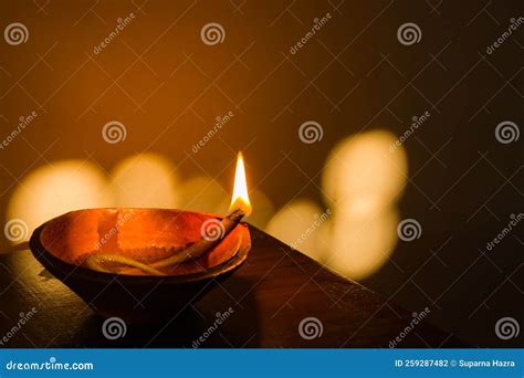 Diya Or Earthen Oil Lamp Lit With Flame During Diwali Celebration In