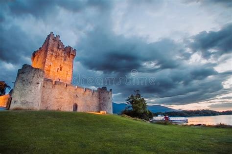 Ancient Old Fortress Ross Castle With A Lake Green Grass And Orange