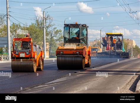 Process Of Asphalting Asphalt Paver Machine And Two Road Rollers