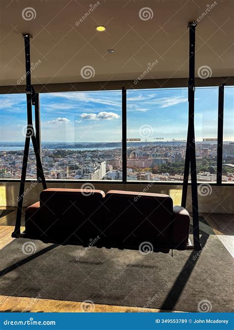 Ounge Swing on the Rooftop of a Hotel with a View of Downtown Lisbon