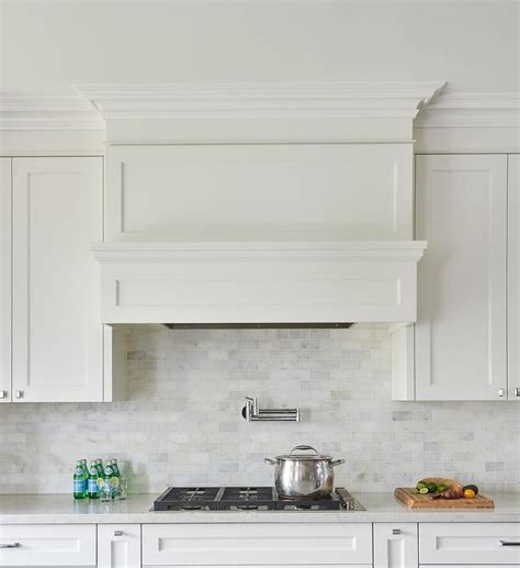 White Wood Panel Range Vent Hood With Pot Filler Transitional Kitchen