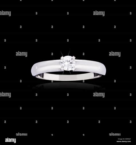 Wedding diamond ring on black background Stock Photo - Alamy