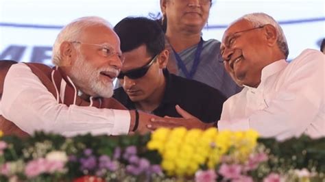 Nitish Kumar Tries To Touch Pm Modi S Feet On Stage Watch Latest