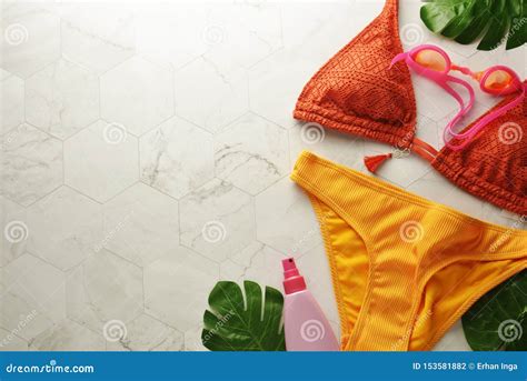 Female Summer Bikini Swimsuit And Accessories Over White Background