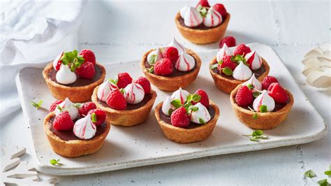 Milk Chocolate Ganache Tarts With Candy Cane Meringues Raspberries And