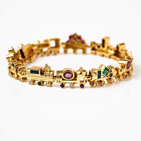 Armband K Guld Dekor Av Fasettslipade Rubiner Safirer Samt