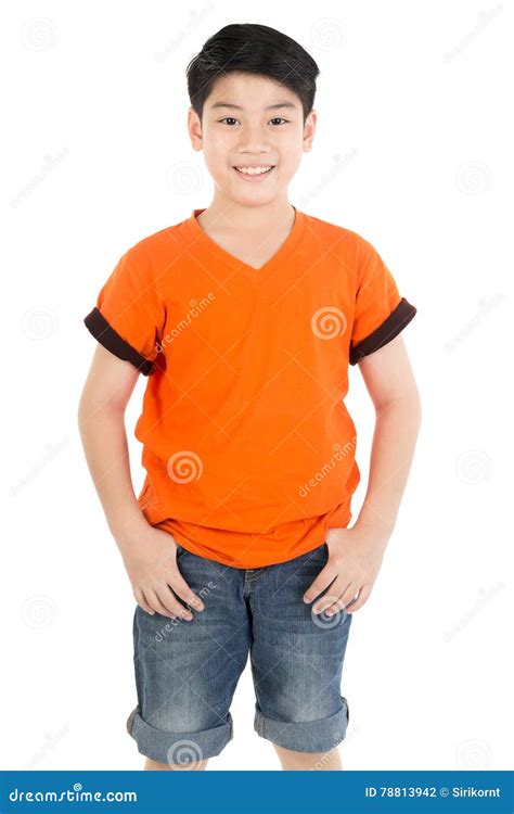 Photo Of Adorable Young Happy Asian Boy Looking At Camera Stock Photo