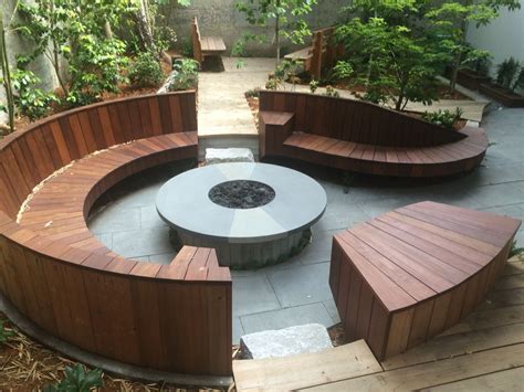 Circular Ipe Bench With Built In Desks Arm Rests And Gas Fire Pit