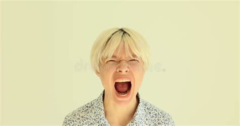 Disgruntled Blonde Woman In Shirt Squints And Screams Loud Stock Footage Video Of Model