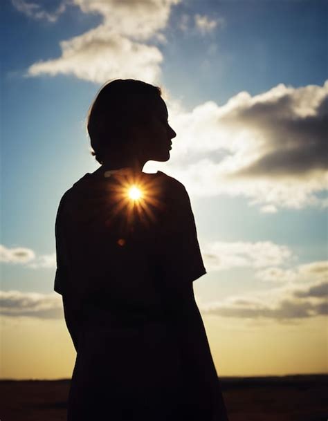 Premium Photo A Silhouette Of A Person Looking The Horizon Realistic