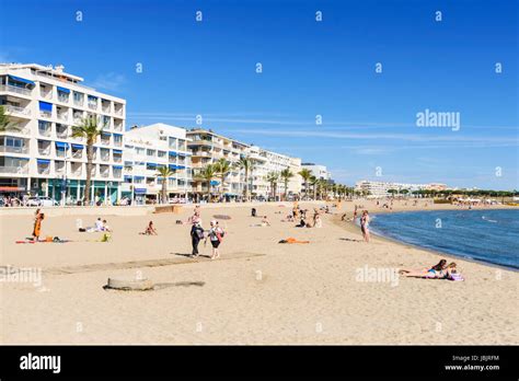 Beach Scene Of People On The Plage Rive Gauche Le Grau Du Roi Gard