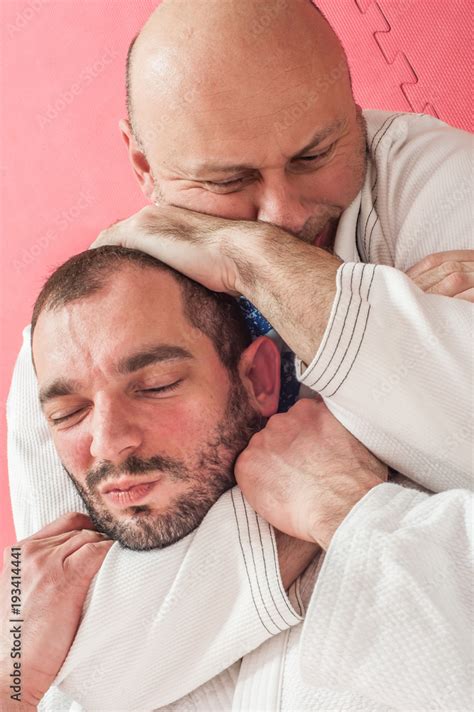 Brazilian Jiu Jitsu Training Demonstration In Traditional Kimono Stock