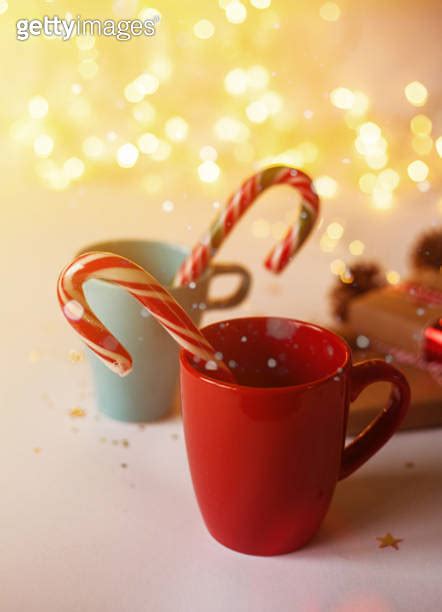 Blue And Red Mugs With Christmas Candies Blurred Lights Shiny Bokeh