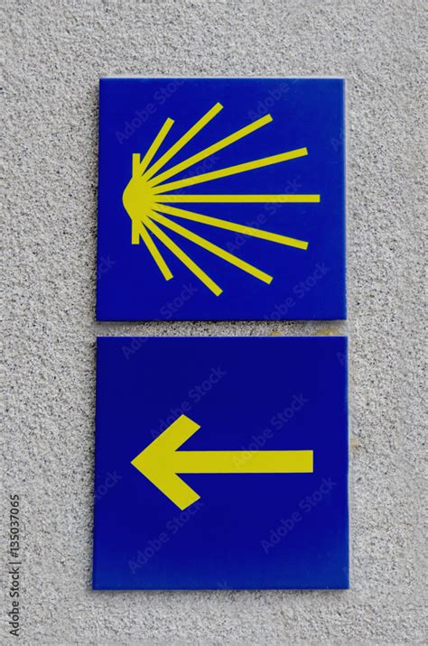 Camino De Santiago Waymarkers Scallop Shell And Yellow Arrow Stock