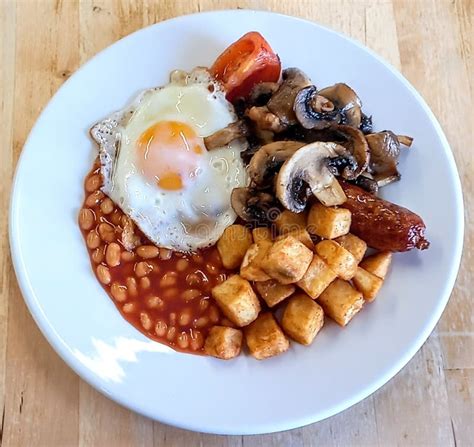 Traditional English Breakfast Served On A Plain White Plate Stock Photo