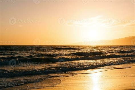 Bright sunset on Santa Monica beach 37006980 Stock Photo at Vecteezy