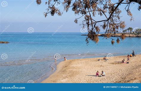 Tourist People Enjoying The Sandy Beach Relaxing Sunbathing And