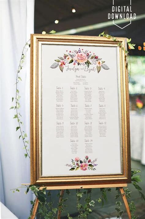 A Wedding Seating Chart With Flowers And Greenery Is Displayed On An