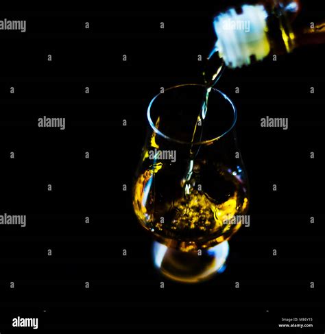 Pouring Single Malt Whisky Into A Glass Golden Color Whisky An