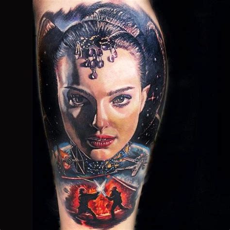 A Woman S Arm With Tattoos On It And An Image Of A Man In The Background