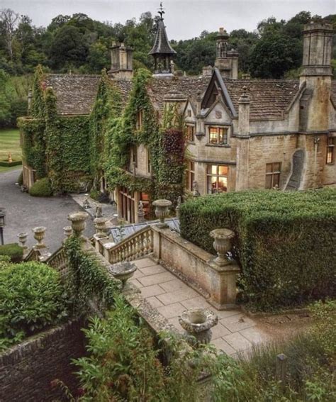 An Old House With Ivy Growing All Over It S Walls And Roof Surrounded