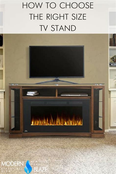 An Entertainment Center With A Television And Fire Place In Front Of It