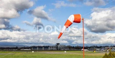 Windsock at an airport with a cloudy sunny sky in background ~ Hi Res ...