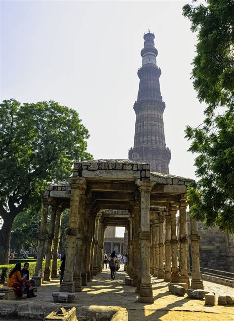 Qutb Minar Tower Seen Through The Ruined Quwwat Ul Islam Mosque At