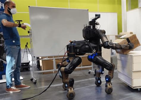 The CENTAURO Robot Is Being Teleoperated To Transport A Box The