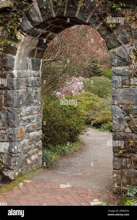 Stone archway and garden path Stock Photo - Alamy