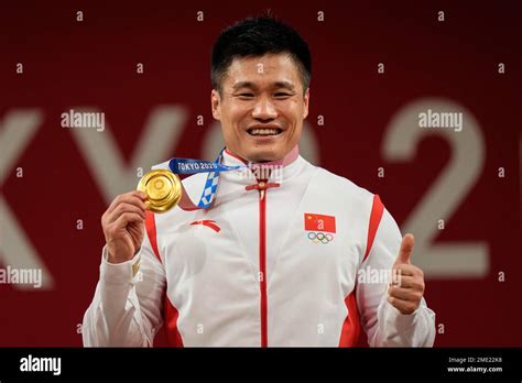 Lyu Xiaojun Of China Celebrates On The Podium After Winning The Gold