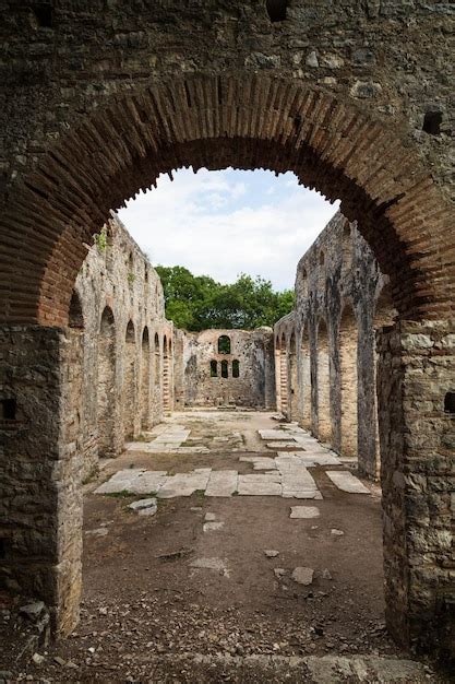 Premium Photo | A stone archway leads to a large archway with a large ...