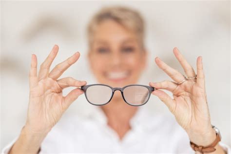 Premium Photo Vision Eyesight And Glasses In Hands With Blur Woman Has Poor Eye Sight Holding